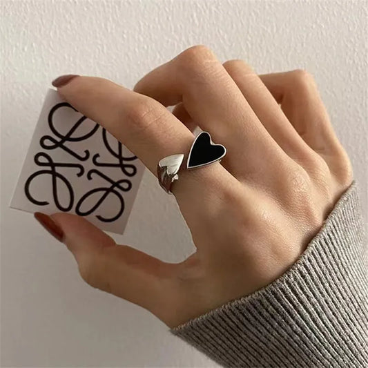 Trendy silver and gold ring in black heart shape